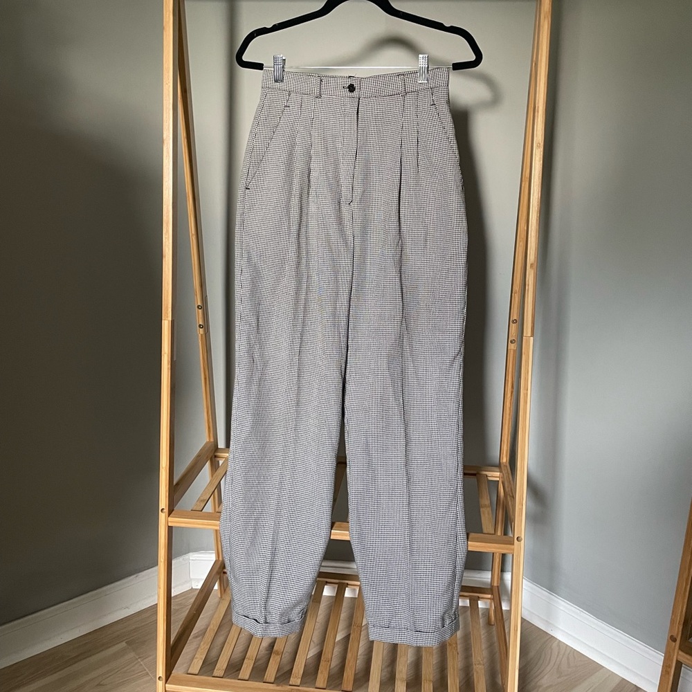 Trendy vintage pants with fitted waist and looser fit along legs!